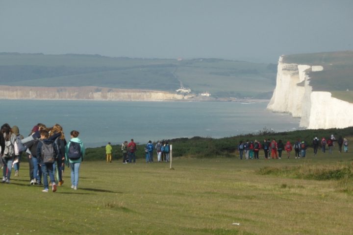 Walking across the grass above the white chalk cliffs on the English south coast